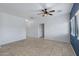 Spacious living room with tile flooring, ceiling fan, and abundant natural light at 2540 E Atlanta Ave, Phoenix, AZ 85040