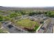 Stunning aerial view showcases the community golf putting green and meticulously maintained landscaping at 26764 W Ponderosa Ln, Buckeye, AZ 85396