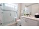 Modern bathroom featuring a glass shower with white tile and a white vanity with a sink at 26764 W Ponderosa Ln, Buckeye, AZ 85396