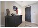 Inviting entryway with a dark wood console table, decorative wreath, and a welcoming ambiance at 26764 W Ponderosa Ln, Buckeye, AZ 85396