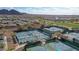 Aerial view of pickleball courts and surrounding residential neighborhood with a golf course at 26764 W Ponderosa Ln, Buckeye, AZ 85396