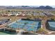 Overhead view of active pickleball courts with mountain backdrop, highlighting the community's recreational offerings at 26764 W Ponderosa Ln, Buckeye, AZ 85396