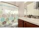 Charming bathroom with modern vanity, and decorative shower curtain at 29390 N 128Th Ln, Peoria, AZ 85383