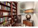 Personal library featuring a vast collection of books and a comfortable reading nook at 29390 N 128Th Ln, Peoria, AZ 85383