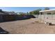 The spacious backyard has a covered patio and cinder block graffiti wall at 3227 W Villa Rita Dr, Phoenix, AZ 85053