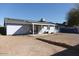 A house backyard with solar panels on the roof and covered patio area at 3227 W Villa Rita Dr, Phoenix, AZ 85053