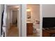 A bathroom visible from a hallway, including a sink, toilet and cabinets at 3227 W Villa Rita Dr, Phoenix, AZ 85053