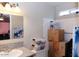 A bathroom featuring a sink and toilet with storage bins nearby at 3227 W Villa Rita Dr, Phoenix, AZ 85053