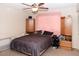 A cozy bedroom with a ceiling fan and a neutral color scheme at 3227 W Villa Rita Dr, Phoenix, AZ 85053