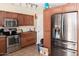 Traditional kitchen showcasing stainless steel appliances and fixtures and a tiled floor at 3227 W Villa Rita Dr, Phoenix, AZ 85053