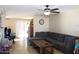 Inviting living room with ceiling fan, neutral paint colors, and an access door to the back patio at 3227 W Villa Rita Dr, Phoenix, AZ 85053