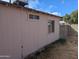 Exterior view of home's backyard showcasing the siding and window details at 3452 E Evans Dr, Phoenix, AZ 85032