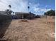 Large backyard featuring block fencing, a covered patio, and space for landscaping and outdoor enjoyment at 3452 E Evans Dr, Phoenix, AZ 85032