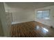 Bedroom with wood floors, window, and room divider at 3452 E Evans Dr, Phoenix, AZ 85032