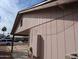 Exterior view of home with peach siding, a carport, and a neatly kept lawn at 3452 E Evans Dr, Phoenix, AZ 85032