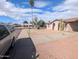 Street view of a single-story home featuring stucco siding and a well-manicured xeriscaped front yard at 3452 E Evans Dr, Phoenix, AZ 85032