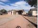 Charming single-story home with stucco exterior, a covered porch, and xeriscaping at 3452 E Evans Dr, Phoenix, AZ 85032