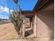 Side exterior view with a desert plant featuring convenient side access to the carport at 3452 E Evans Dr, Phoenix, AZ 85032