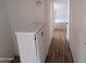 Hallway showcases built-in shelving and hardwood flooring at 3452 E Evans Dr, Phoenix, AZ 85032