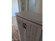 Hallway view showing wood laminate floor and hallway linen closet at 3452 E Evans Dr, Phoenix, AZ 85032