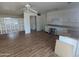 Kitchen and living area featuring wood floors, white cabinets and decorative divider at 3452 E Evans Dr, Phoenix, AZ 85032