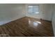 Living room with wood-look floors and a door to the exterior at 3452 E Evans Dr, Phoenix, AZ 85032