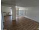 Open concept living room leading into a dining area with kitchen beyond at 3452 E Evans Dr, Phoenix, AZ 85032