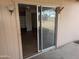 View through sliding glass door into living room with ceiling fan and decorative room divider at 3452 E Evans Dr, Phoenix, AZ 85032