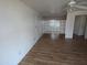 Living room showing wood-look floors and a decorative privacy screen at 3452 E Evans Dr, Phoenix, AZ 85032