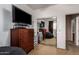 Bedroom with large dresser and TV reflected in sliding mirror door at 3588 S 257Th Ave, Buckeye, AZ 85326