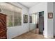 Bedroom featuring a window with blinds and closet with sliding mirror doors at 3588 S 257Th Ave, Buckeye, AZ 85326