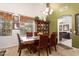 Inviting dining room with classic wood furniture, chandelier, and decorative display case at 3588 S 257Th Ave, Buckeye, AZ 85326