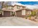 Two-story home with a three-car garage, lush landscaping, and a tile roof at 3588 S 257Th Ave, Buckeye, AZ 85326