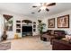 Open living room with a built-in entertainment center and comfortable furnishings at 3588 S 257Th Ave, Buckeye, AZ 85326