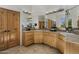 Bathroom with a large mirror, double sinks, and custom wood cabinetry at 36102 N Creek View Ln, Cave Creek, AZ 85331