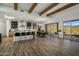 Open kitchen and dining area with chef's island and sliding glass doors to outdoor living space at 36102 N Creek View Ln, Cave Creek, AZ 85331