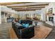 Bright living room boasts wood-beamed ceilings, modern furnishings, and picturesque mountain views at 36102 N Creek View Ln, Cave Creek, AZ 85331