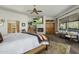 Elegant bedroom featuring a fireplace, mountain views, and ensuite bathroom access at 36102 N Creek View Ln, Cave Creek, AZ 85331