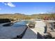 Beautiful backyard pool and spa with mountain views, outdoor seating, and a cozy fire pit, ideal for relaxation and entertaining at 36102 N Creek View Ln, Cave Creek, AZ 85331