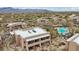 Luxury condo community with mountain views, lush desert landscape, and a sparkling community pool at 36601 N Mule Train Rd # C38, Carefree, AZ 85377