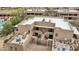 Wonderful aerial view of the patios, entryways, and architecture of the property and adjacent landscaping at 36601 N Mule Train Rd # C38, Carefree, AZ 85377