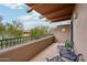 Serene balcony featuring iron seating and lush greenery, providing a tranquil outdoor space to relax and enjoy at 36601 N Mule Train Rd # C38, Carefree, AZ 85377