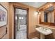 Bathroom with a soaking tub and a view of the pedestal sink at 36601 N Mule Train Rd # C38, Carefree, AZ 85377