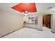 Bright dining area with chandelier and bar counter adjacent to an efficient kitchen with wood cabinets at 36601 N Mule Train Rd # C38, Carefree, AZ 85377