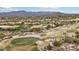 Picturesque desert golf course with green putting greens and mountain views at 36601 N Mule Train Rd # C38, Carefree, AZ 85377