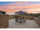 Outdoor patio with table, umbrella, and seating, perfect for outdoor dining and enjoying the desert landscape at 36601 N Mule Train Rd # C38, Carefree, AZ 85377