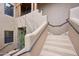 Close-up of a stylish staircase with metal railing and desert landscaping at 36601 N Mule Train Rd # C38, Carefree, AZ 85377