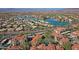 Scenic aerial view of homes surrounding a lake with views of mountains in the distance at 3830 E Lakewood E Pkwy # 2009, Phoenix, AZ 85048