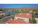 Scenic aerial view of waterfront homes near the lake with mountains in the background at 3830 E Lakewood E Pkwy # 2009, Phoenix, AZ 85048