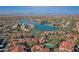 A high-angle shot shows a community near a lake and road, set against a mountain backdrop at 3830 E Lakewood E Pkwy # 2009, Phoenix, AZ 85048